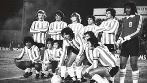 Racing de Córdoba 1980. Osvaldo Coloccini, Pascual Noriega, Lucio del Mul, Héctor Maldonado, Angel Feliú y Juan Manuel Ramos. Abajo: Araña Luis Amuchástegui, Roberto Gasparini, Miguel Ballejo, Oscar López y Guillermo Aramayo.